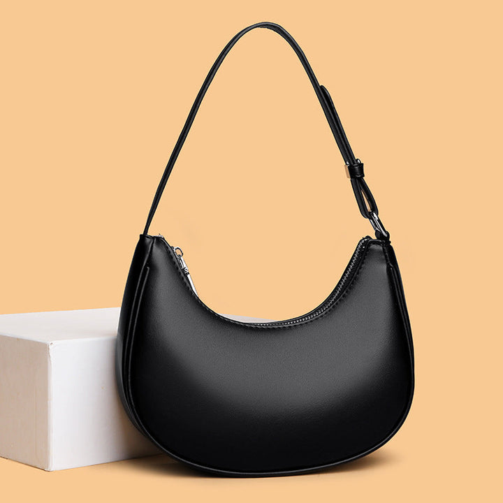 Avellie Half-moon shaped leather bag | Modern design with adjustable shoulder strap